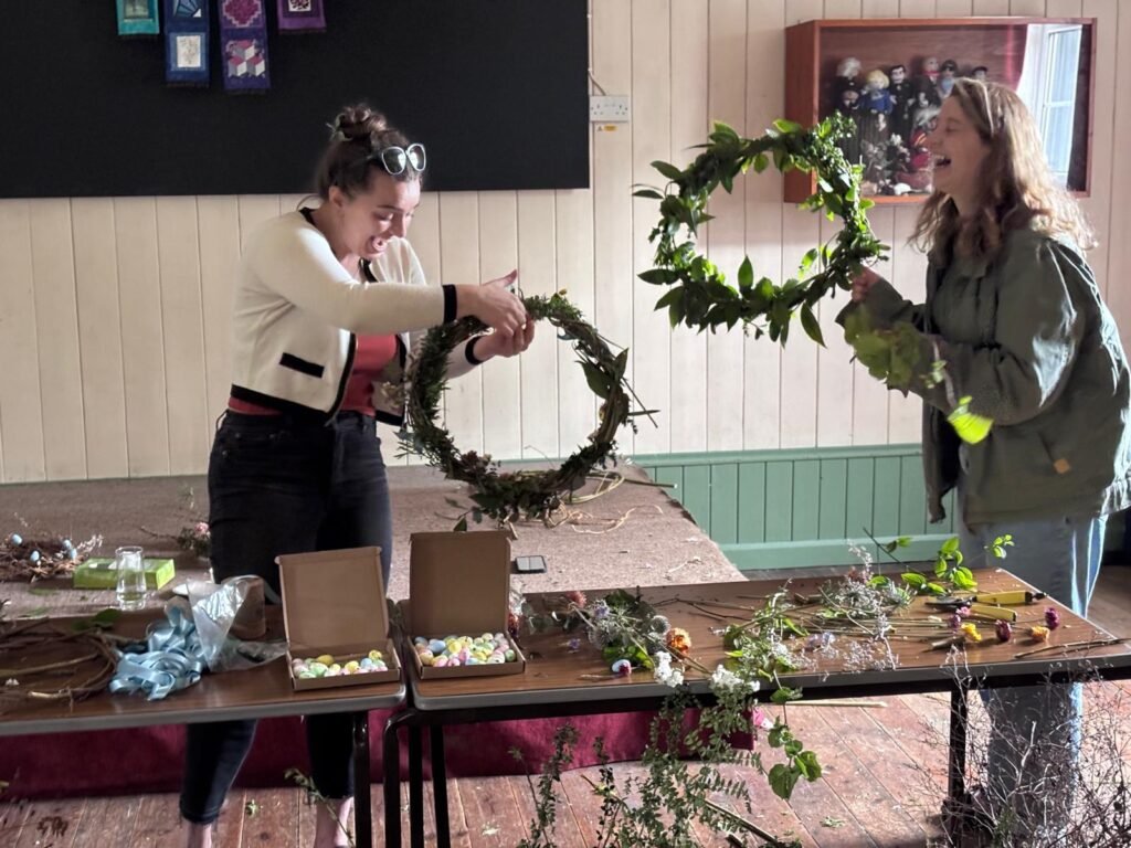 Two people making wreaths